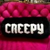 SOURPUSS FURRY CREEPY BOLSTER PILLOW