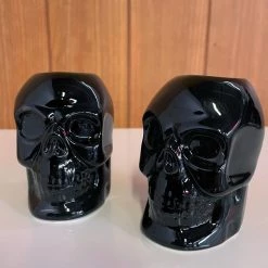 Haunted Homewares SOURPUSS SKULL CANDLESTICK HOLDERS BLACK