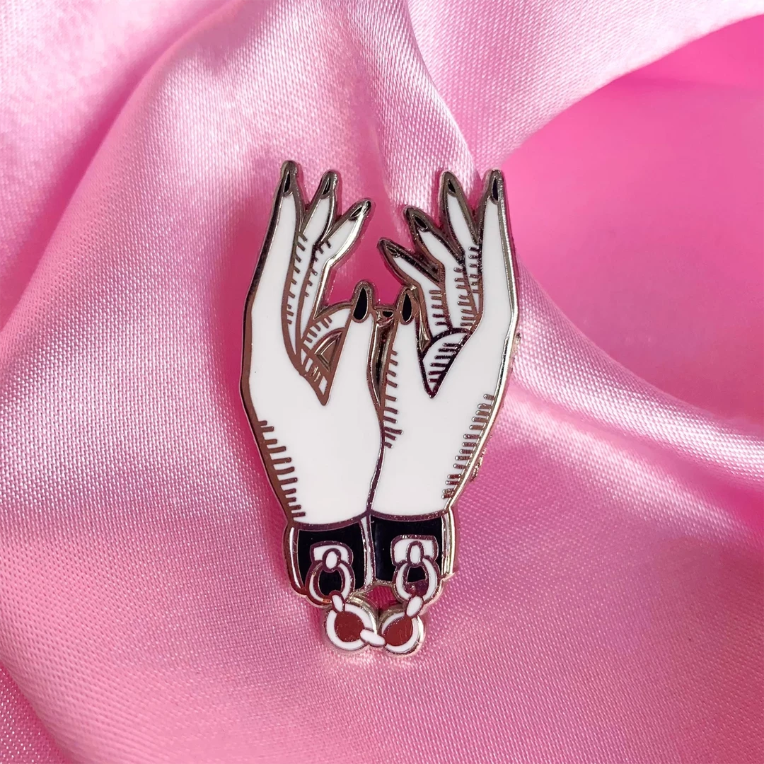 BOBBY PINS CO. TIED HANDS ENAMEL PIN Back In Stock